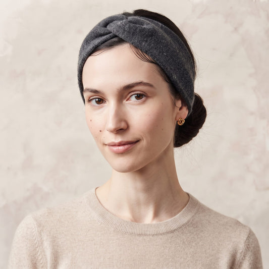 Undyed Gomba twisted-front cashmere headband in Dark Grey Melange, worn front