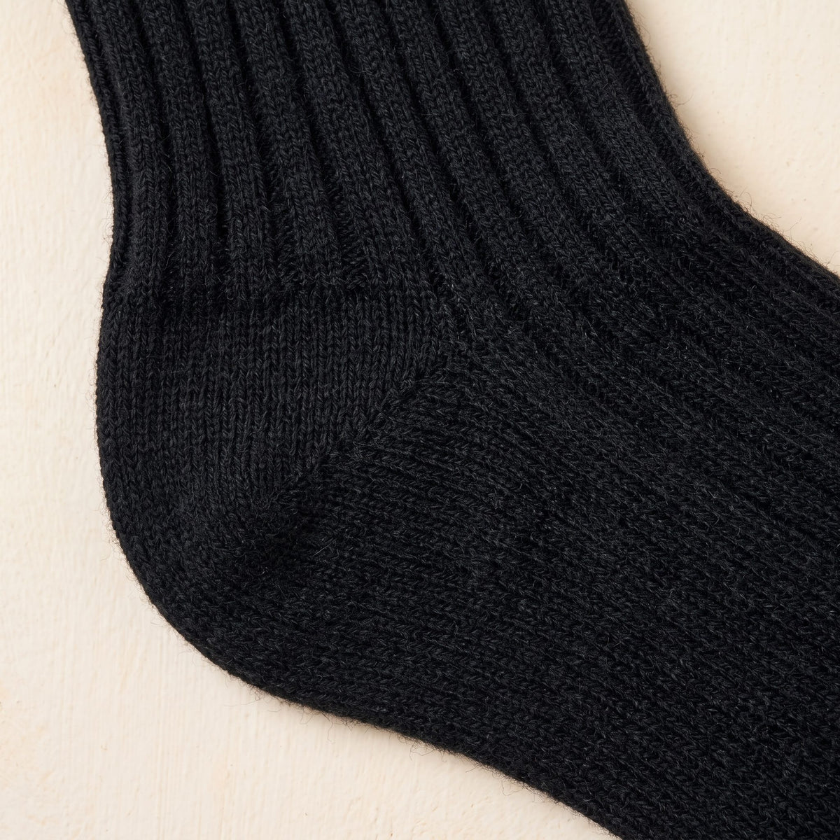 Black women's 100% cashmere knee-high socks - knit texture close-up