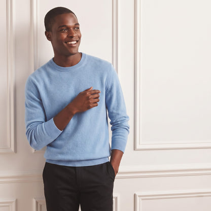 Sky blue men's 100% cashmere crewneck sweater - front view, hand at chest