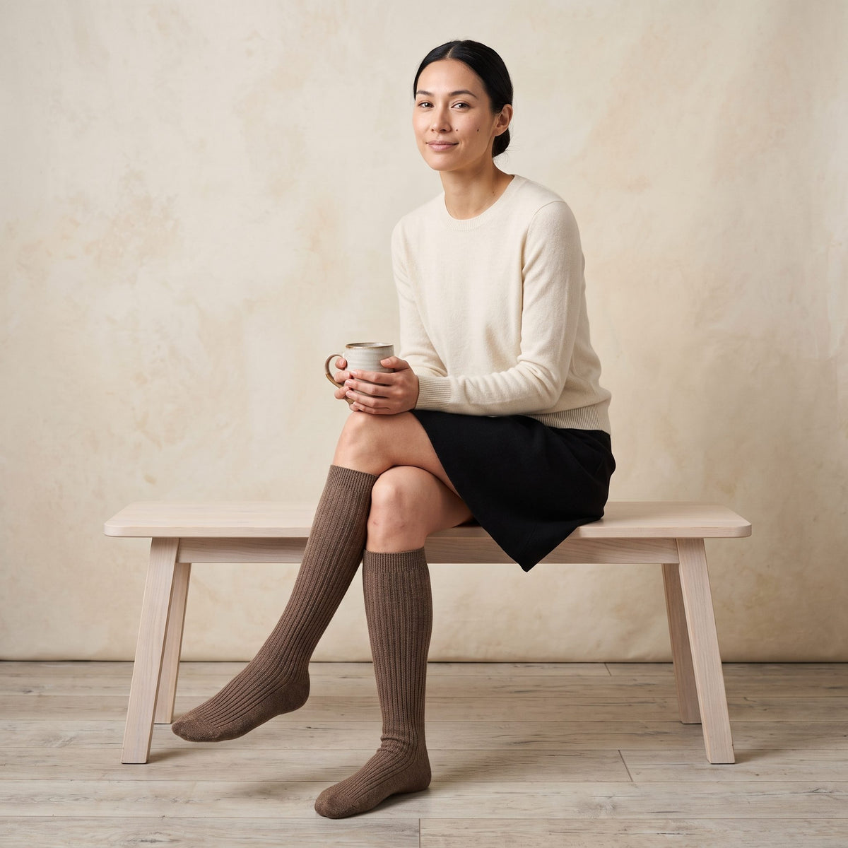 Brown women's 100% cashmere knee-high socks - worn by a model, view 1