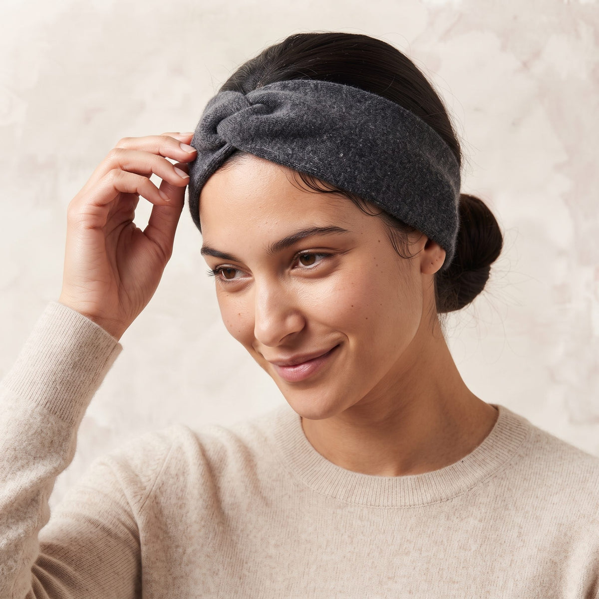 Undyed Gomba twisted-front cashmere headband in Dark Grey Melange, worn, adjusting