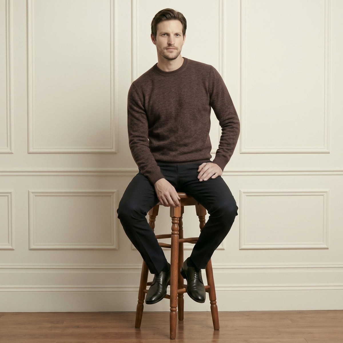 Brown men's 100% cashmere crewneck sweater - seated front view on model