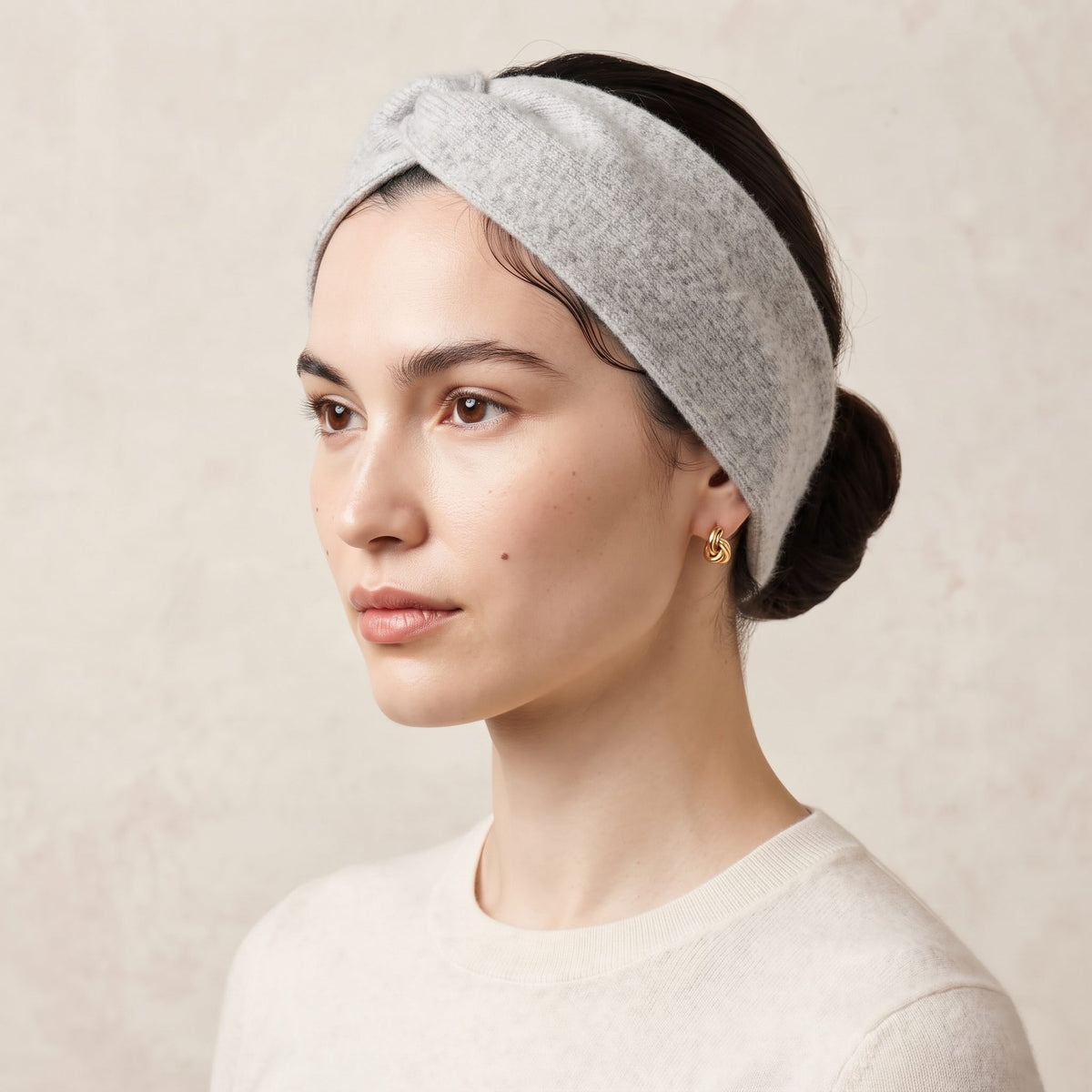 Undyed Gomba twisted-front cashmere headband in Light Grey Melange, worn side