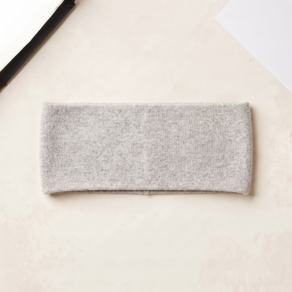 Undyed Gomba twisted-front cashmere headband in Light Grey Melange, flat back