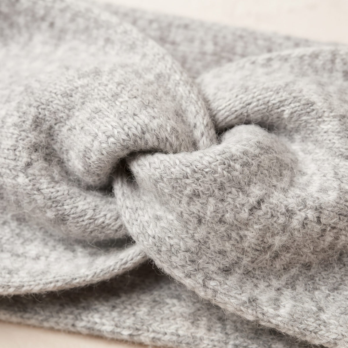 Undyed Gomba twisted-front cashmere headband in Light Grey Melange, twist detail