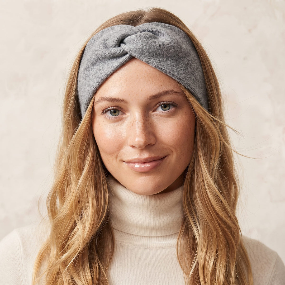 Undyed Gomba twisted-front cashmere headband in Mid Grey Melange, worn front