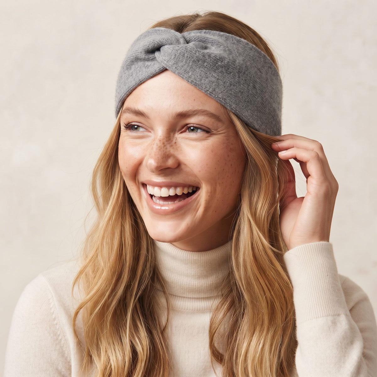 Undyed Gomba twisted-front cashmere headband in Mid Grey Melange, worn, adjusting