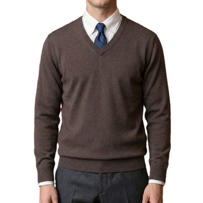 Brown sweater over a white shirt with a blue tie on a white background