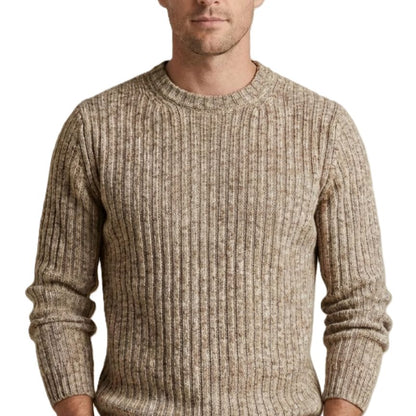 Man wearing a beige ribbed sweater on a white background