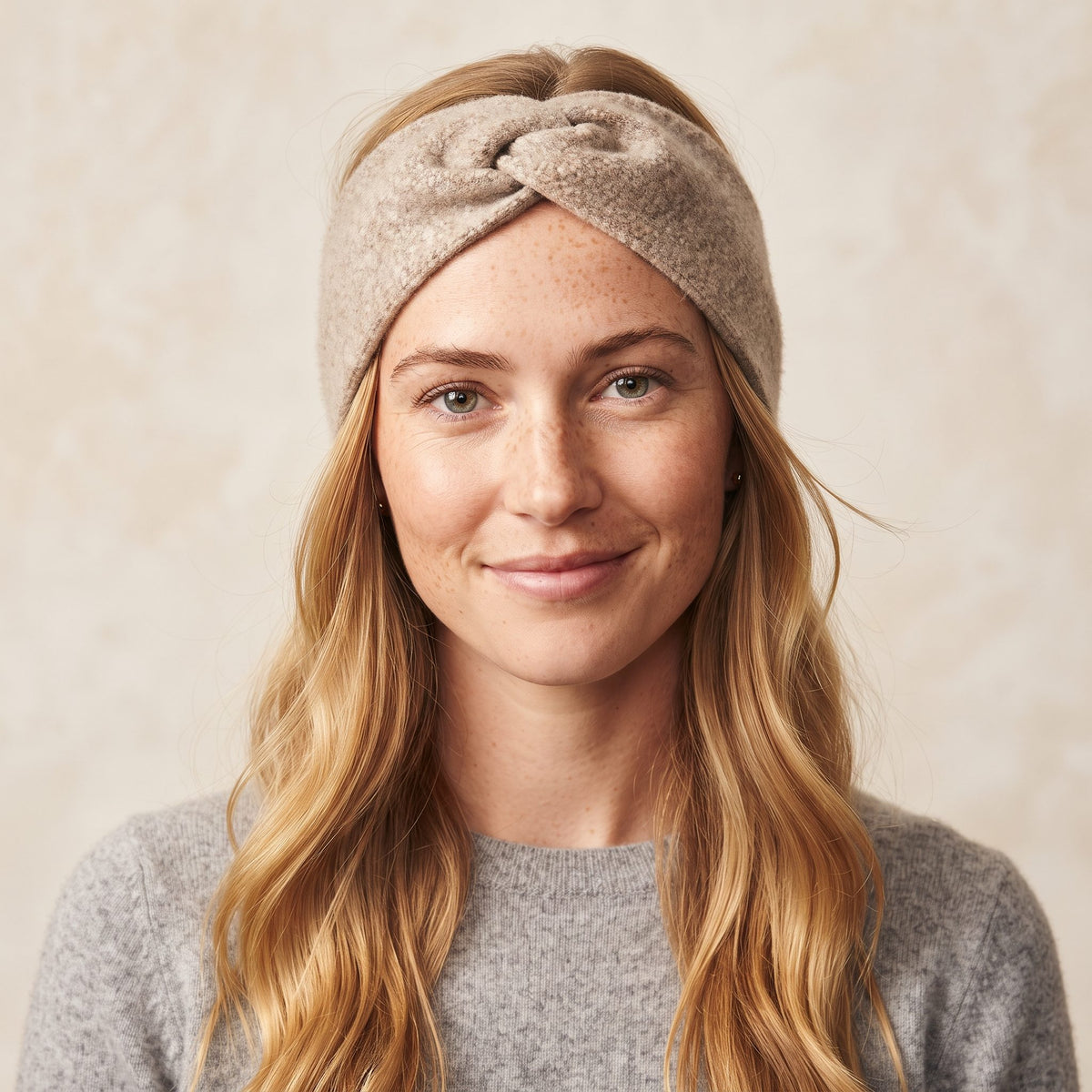 Undyed Gomba twisted-front cashmere headband in Oatmeal Melange, worn front