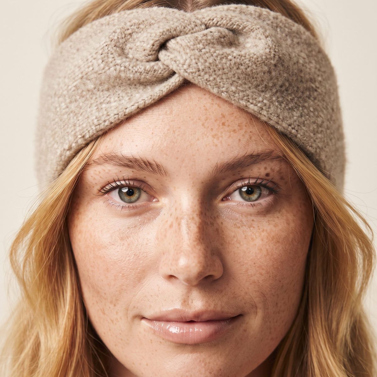 Undyed Gomba twisted-front cashmere headband in Oatmeal Melange, worn close