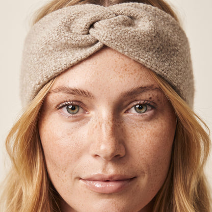 Undyed Gomba twisted-front cashmere headband in Oatmeal Melange, worn close