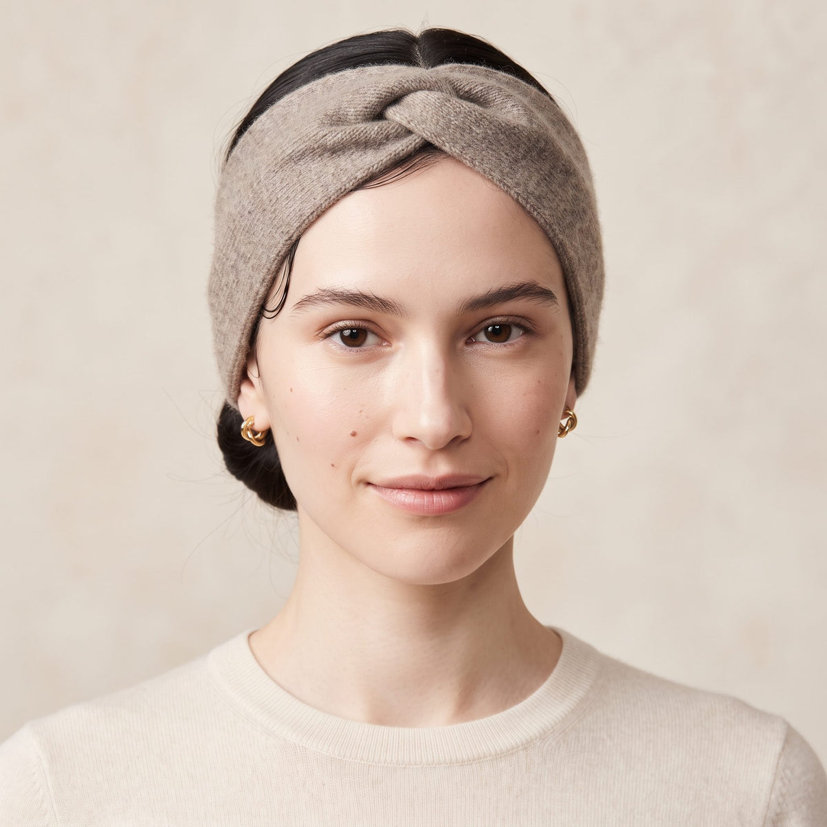 Undyed Gomba twisted-front cashmere headband in Toast Melange, worn front
