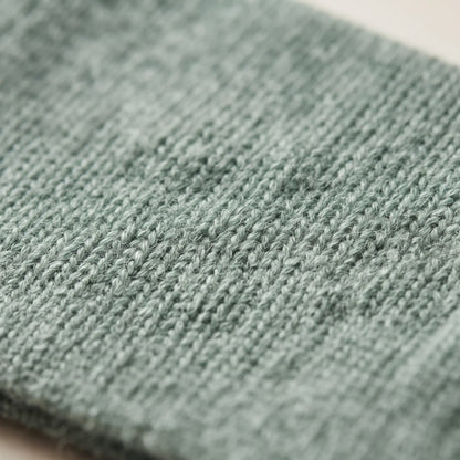 Gomba twisted-front cashmere headband in Heathered Jade, knit texture
