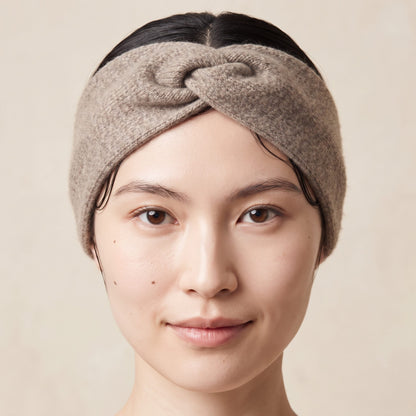 Undyed Gomba twisted-front cashmere headband in Toast Melange, worn close
