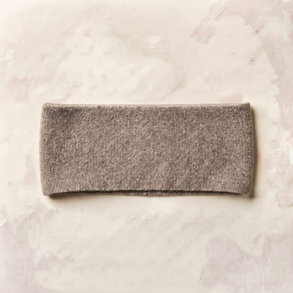 Undyed Gomba twisted-front cashmere headband in Toast Melange, flat back