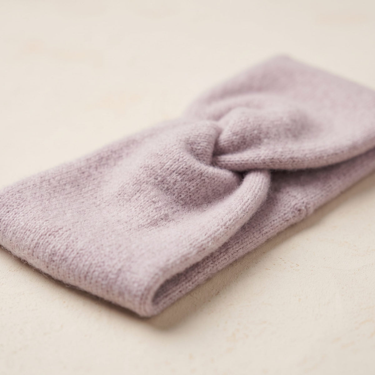 Gomba twisted-front cashmere headband in Lilac, flat angled