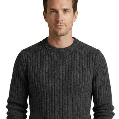 Man wearing a dark gray ribbed sweater on a white background