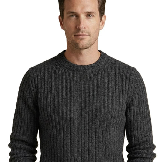 Man wearing a dark gray ribbed sweater on a white background