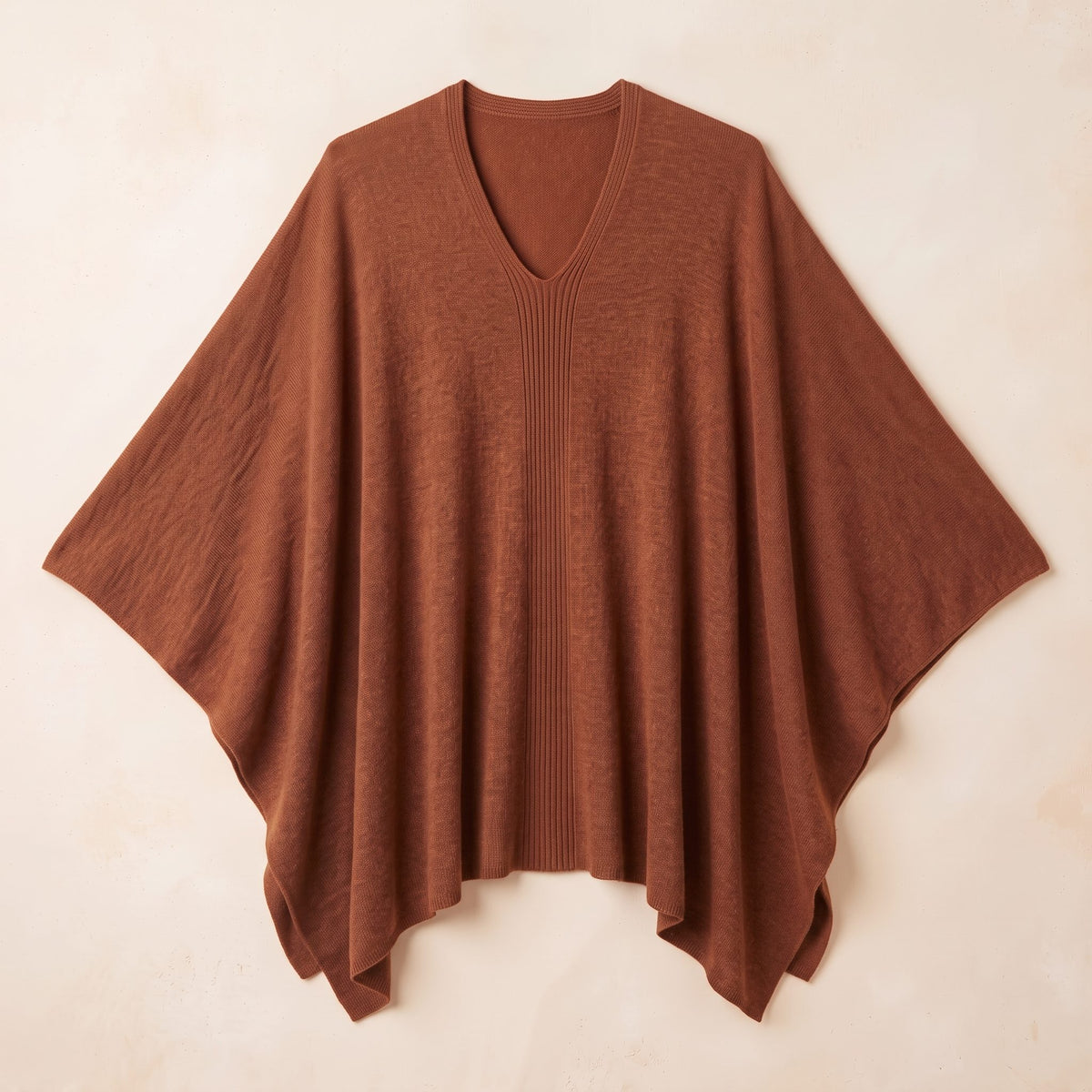 Women's V-neck cashmere poncho in Amber — laid flat