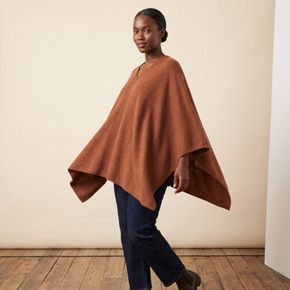 Women's V-neck cashmere poncho in Amber — worn by a model (3)