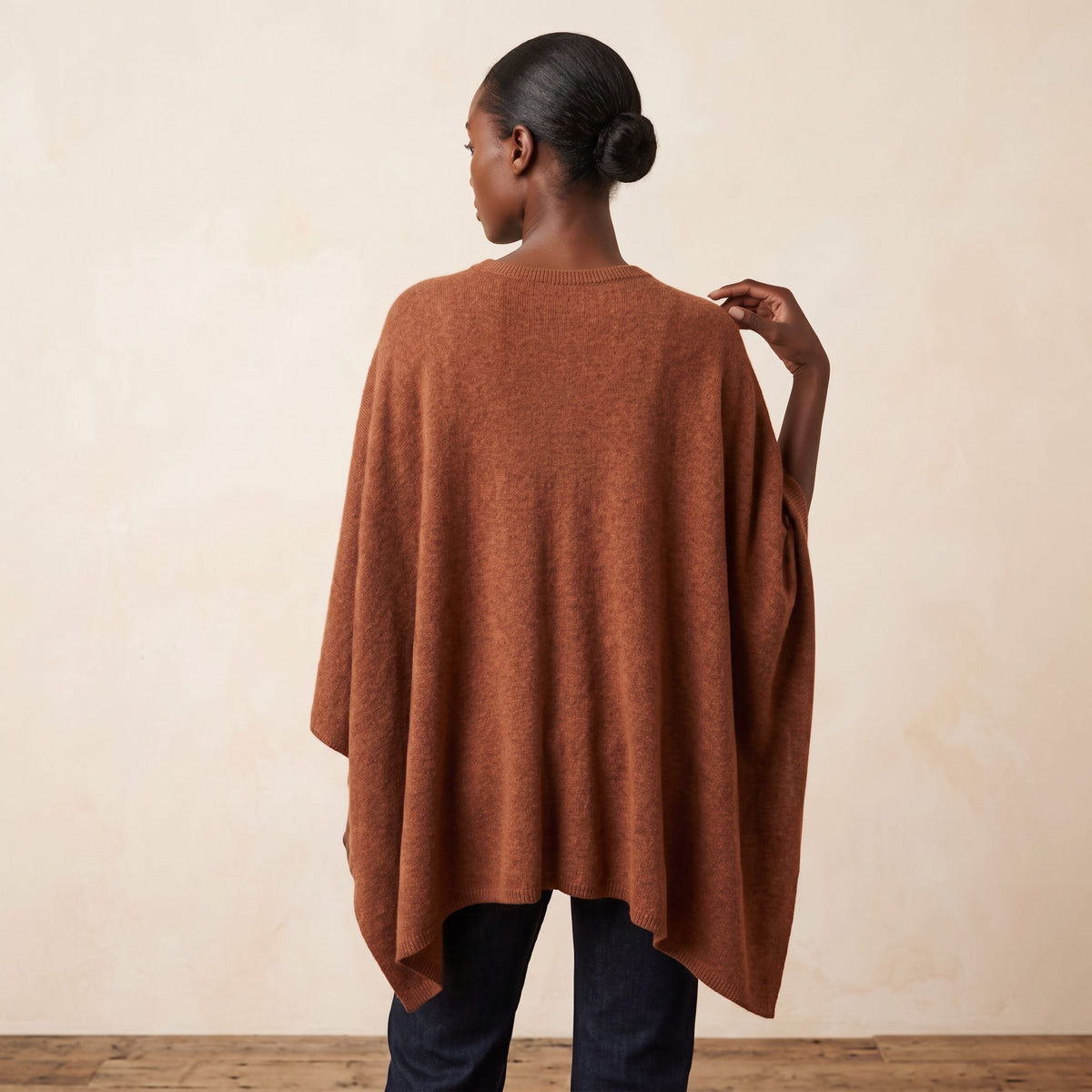 Women's V-neck cashmere poncho in Amber — worn by a model (4)