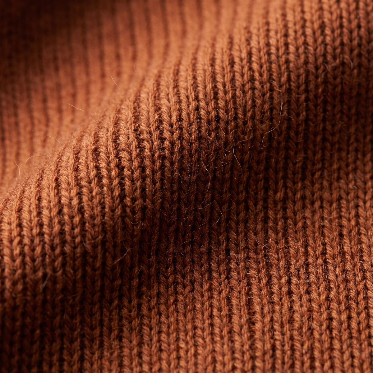 Women's V-neck cashmere poncho in Amber — knit texture detail