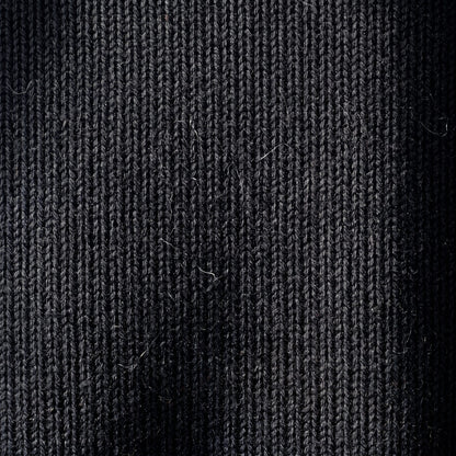 Women's V-neck cashmere poncho in Black — knit texture detail