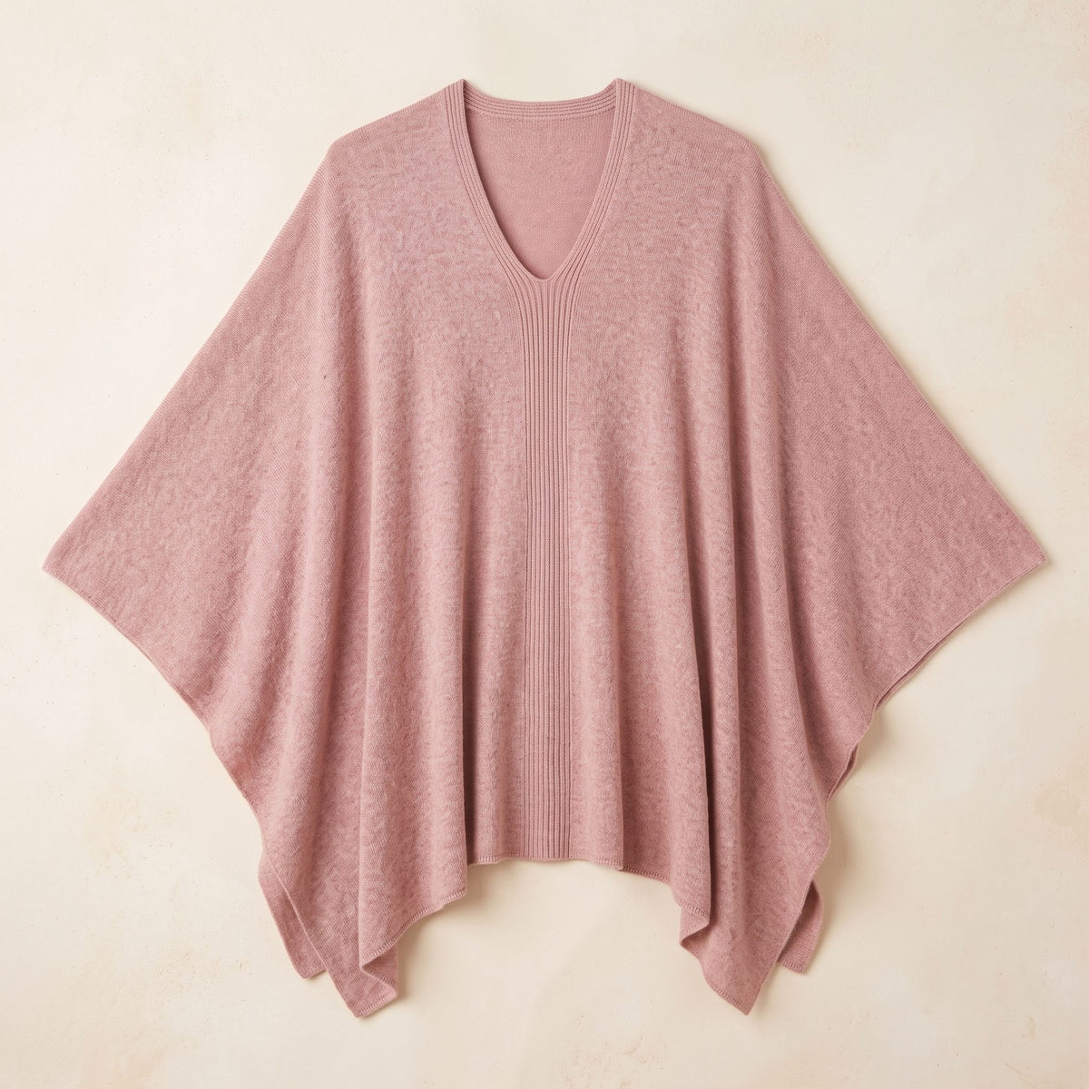 Women's V-neck cashmere poncho in Blush Pink — laid flat