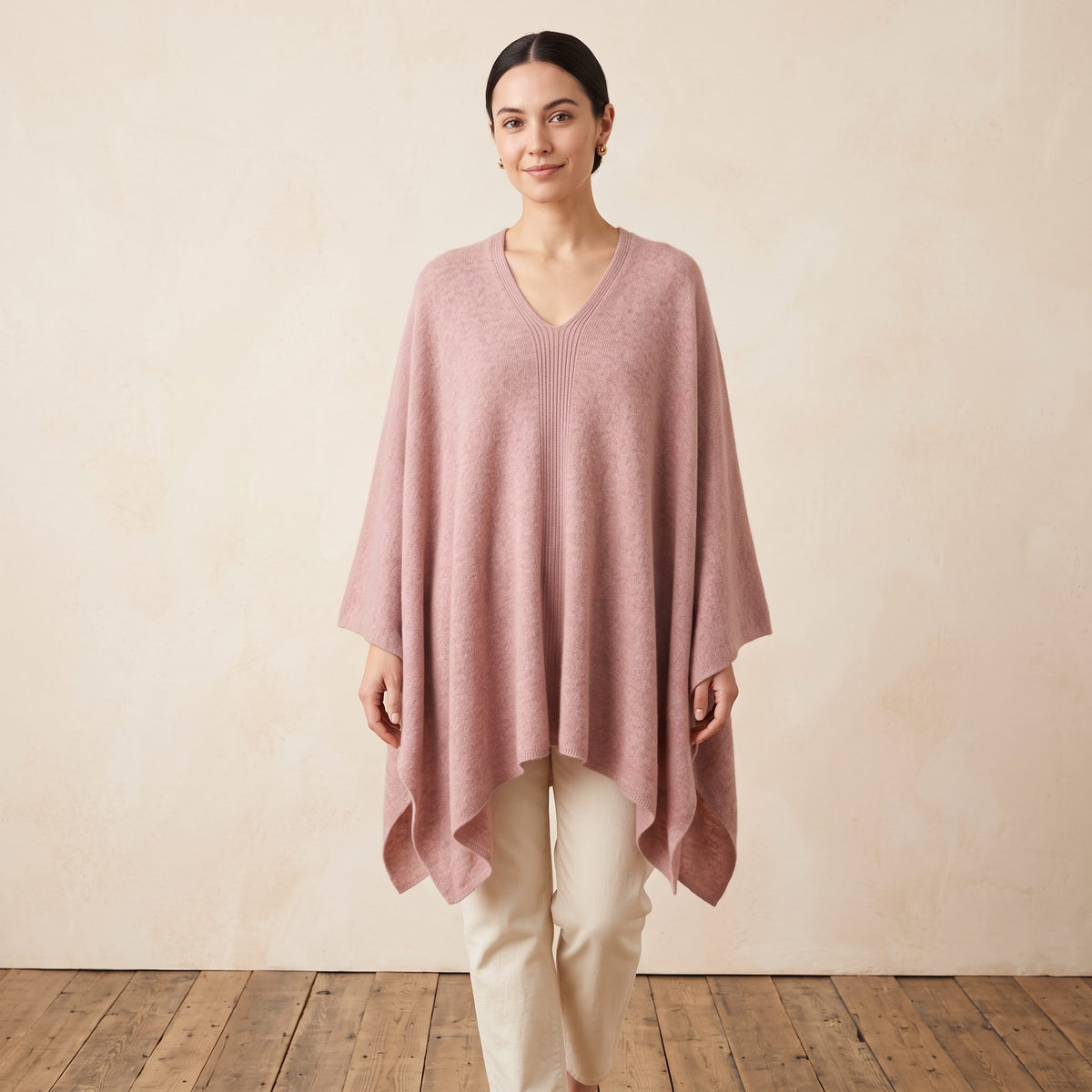 Women's V-neck cashmere poncho in Blush Pink — worn by a model (2)