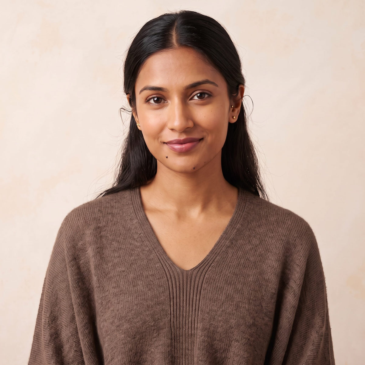 Women's V-neck cashmere poncho in Brown — worn by a model
