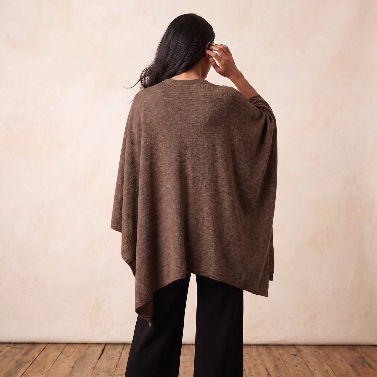 Women's V-neck cashmere poncho in Brown — worn by a model (4)