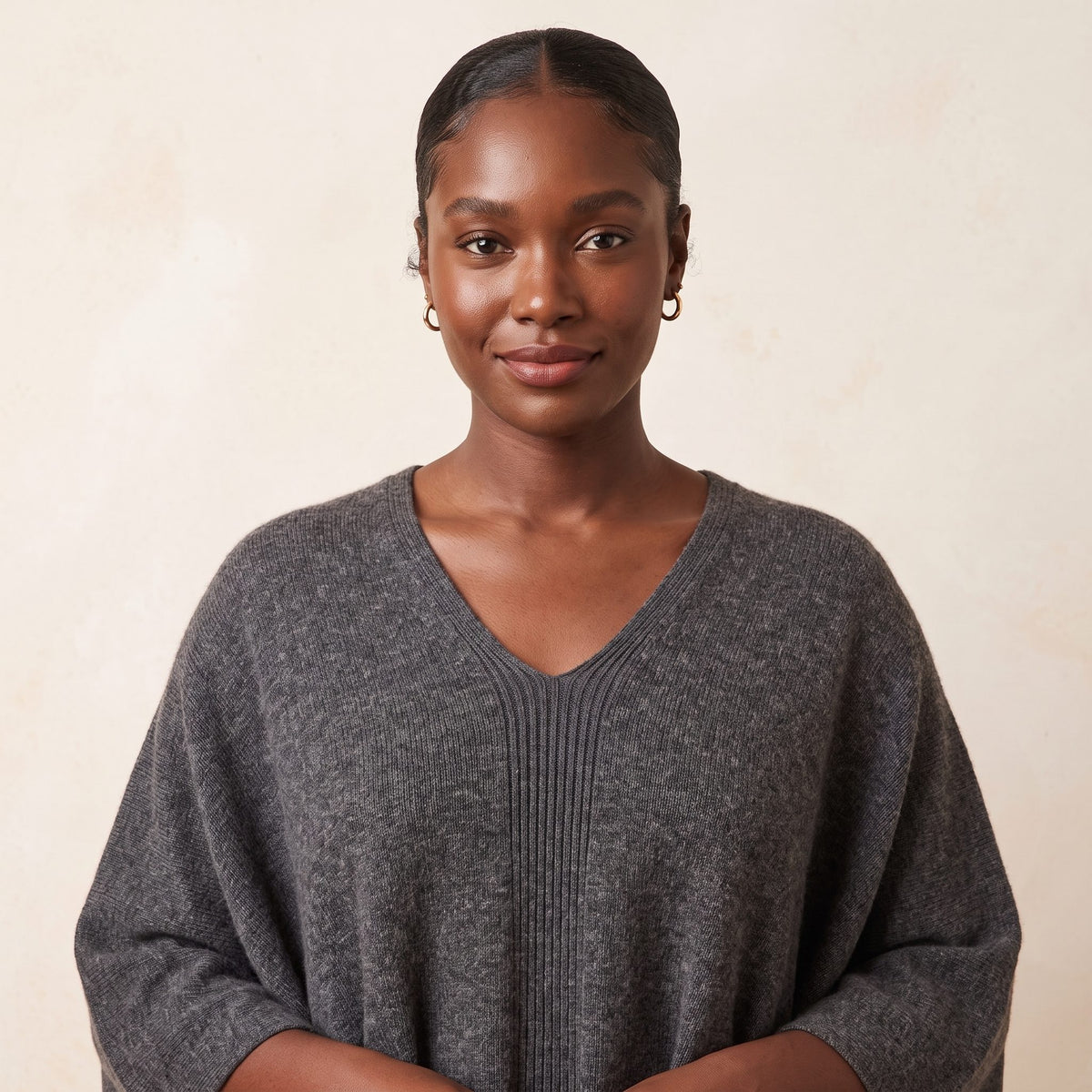 Women's undyed cashmere poncho in Dark Grey Melange — worn by a model