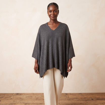 Women's undyed cashmere poncho in Dark Grey Melange — worn by a model (2)