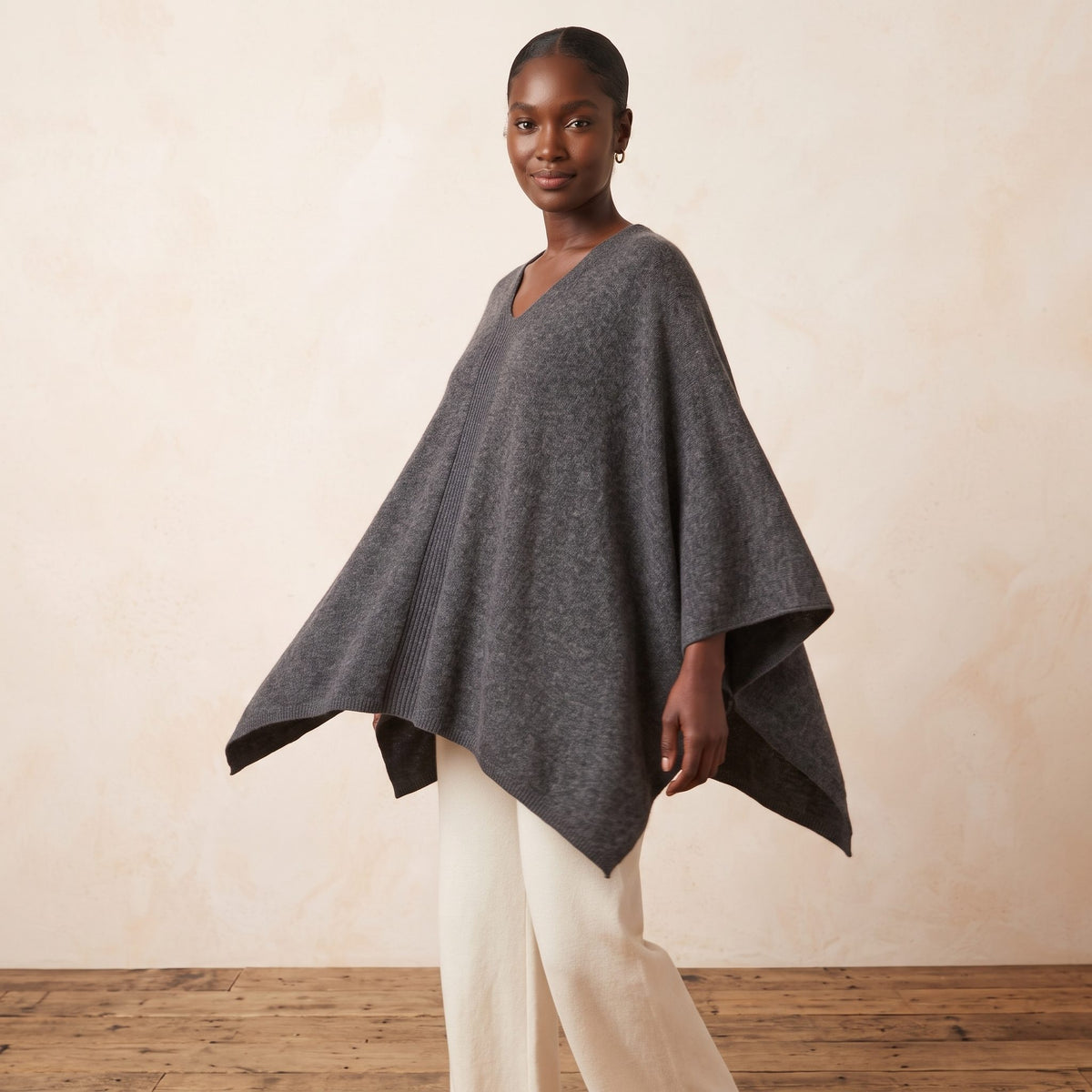 Women's undyed cashmere poncho in Dark Grey Melange — worn by a model (3)