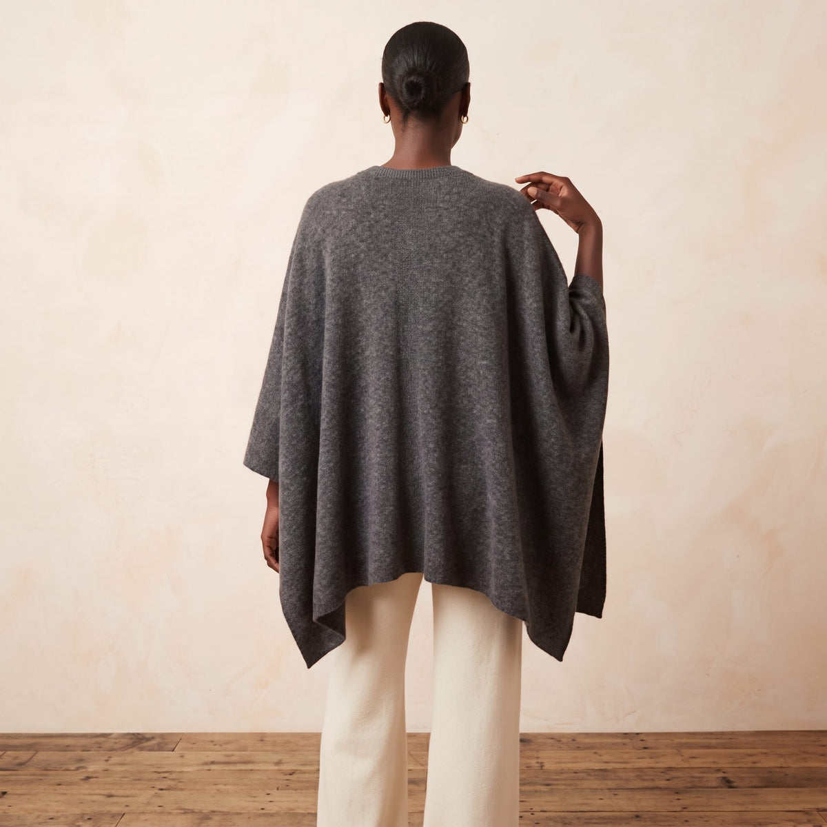 Women's undyed cashmere poncho in Dark Grey Melange — worn by a model (4)