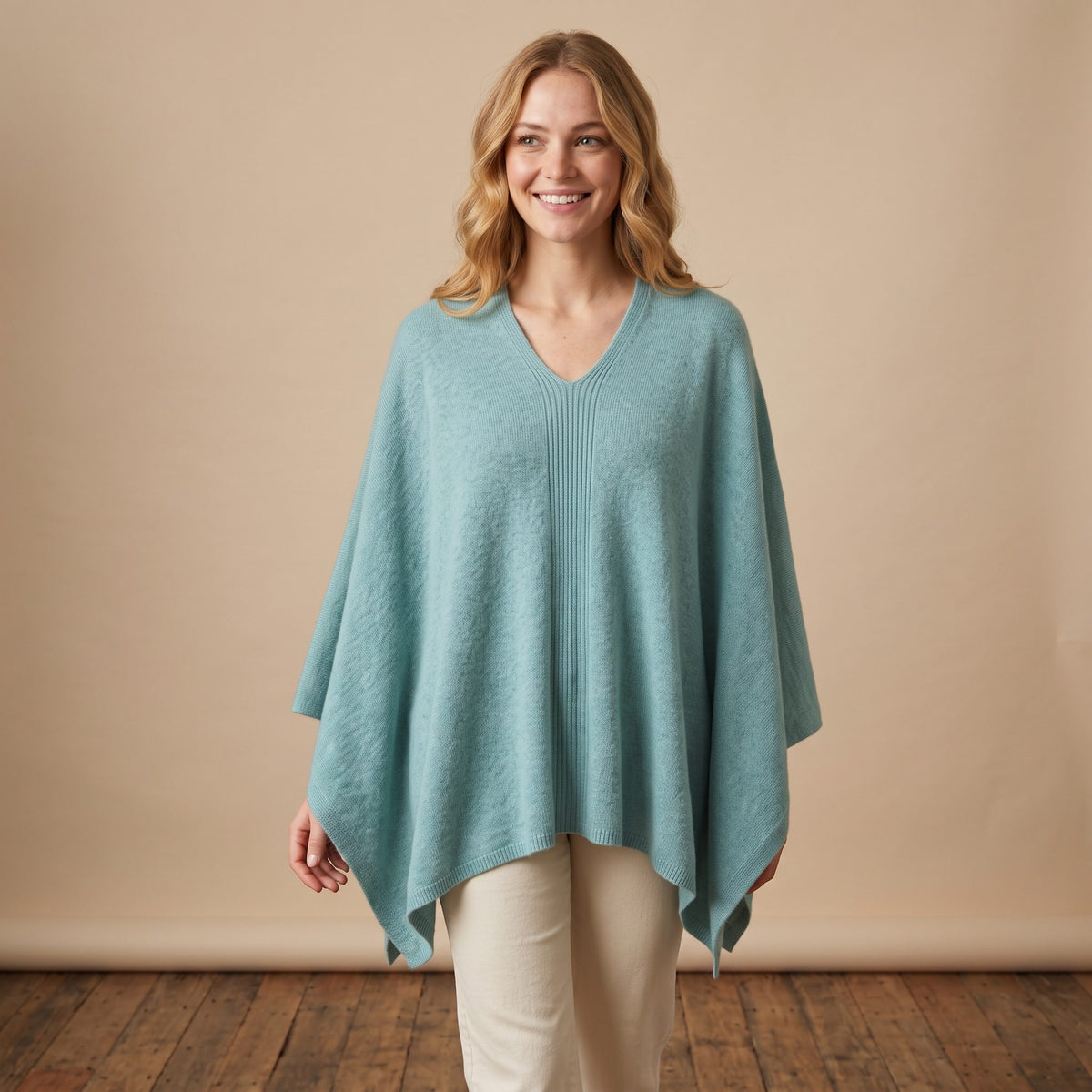 Women's V-neck cashmere poncho in Heathered Jade — worn by a model (2)