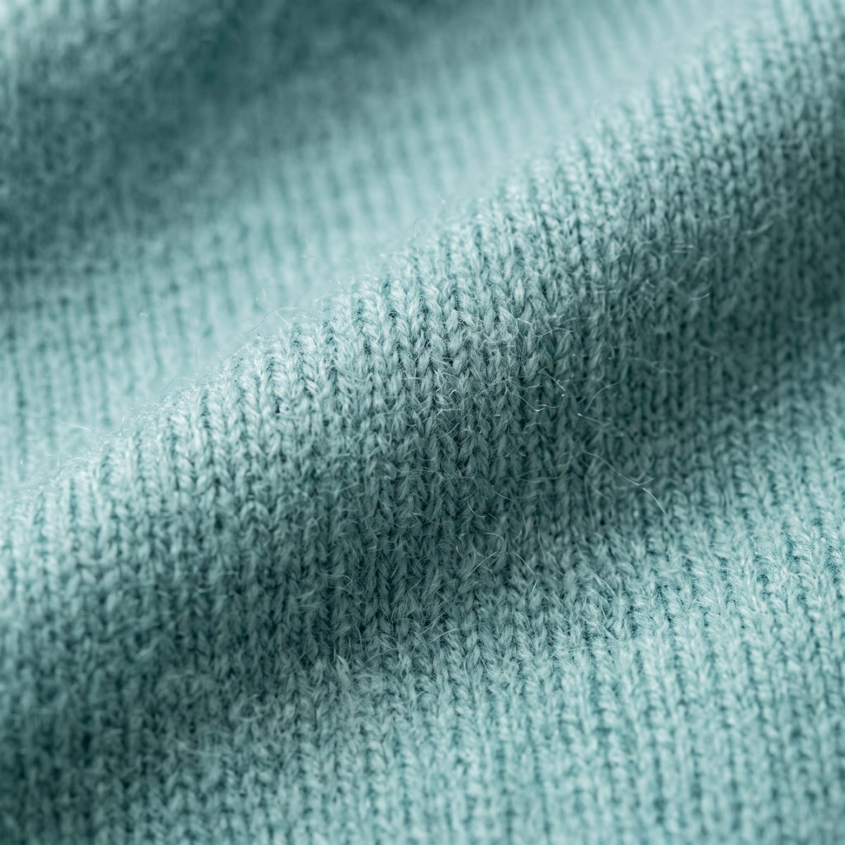 Women's V-neck cashmere poncho in Heathered Jade — knit texture detail
