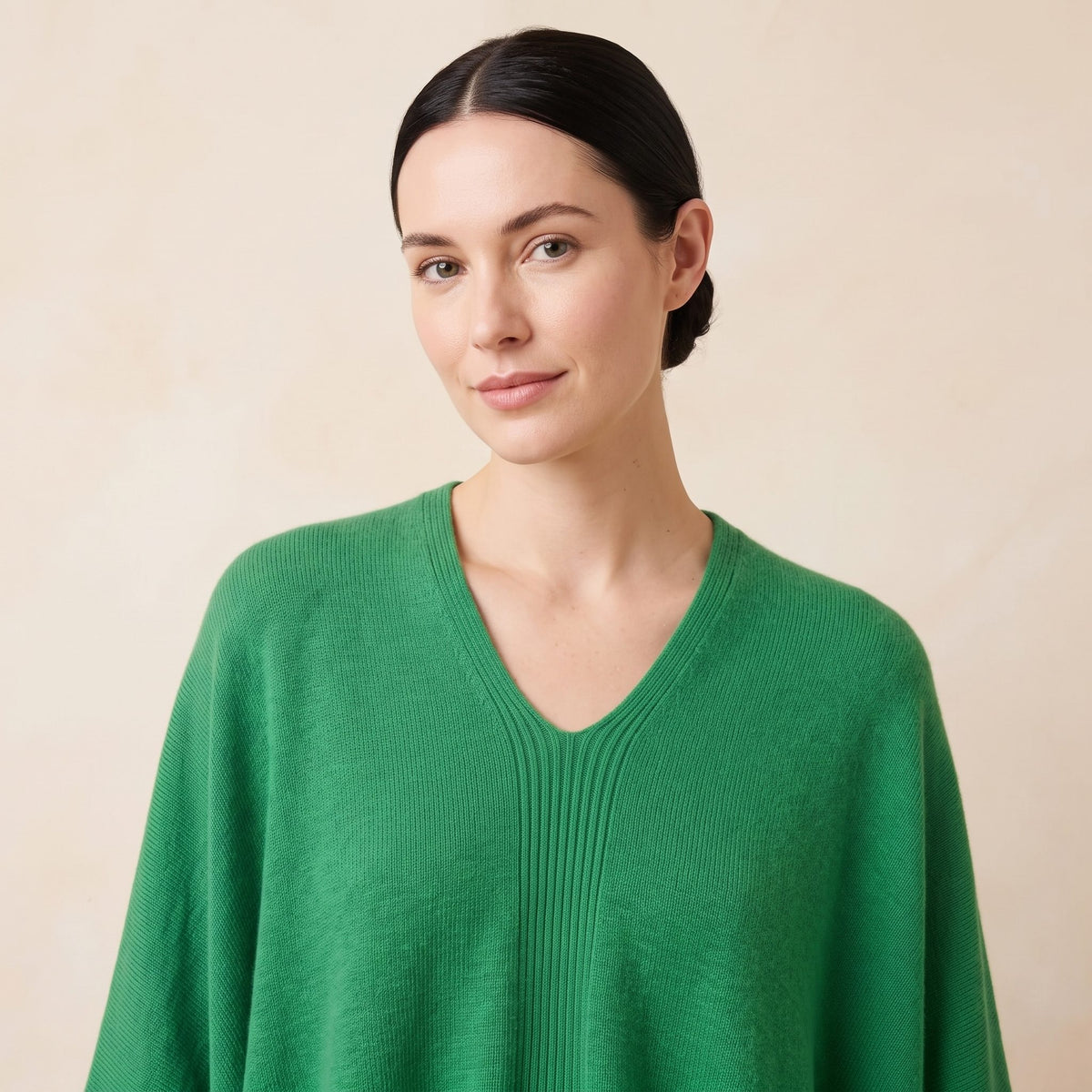 Women's V-neck cashmere poncho in Kelly Green — worn by a model