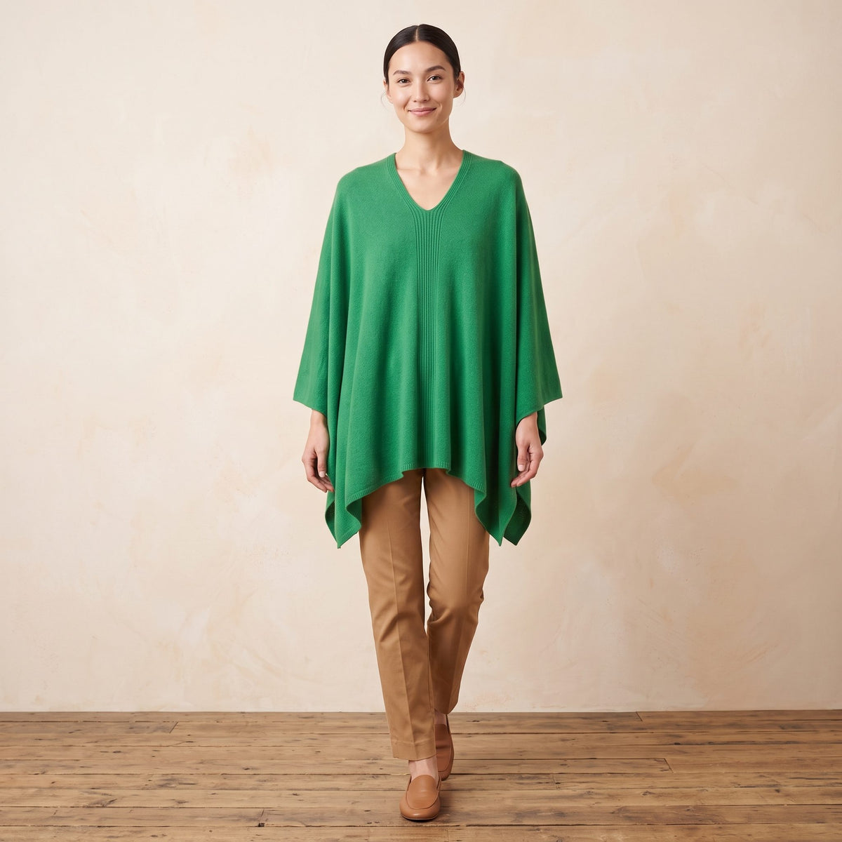 Women's V-neck cashmere poncho in Kelly Green — worn by a model (2)