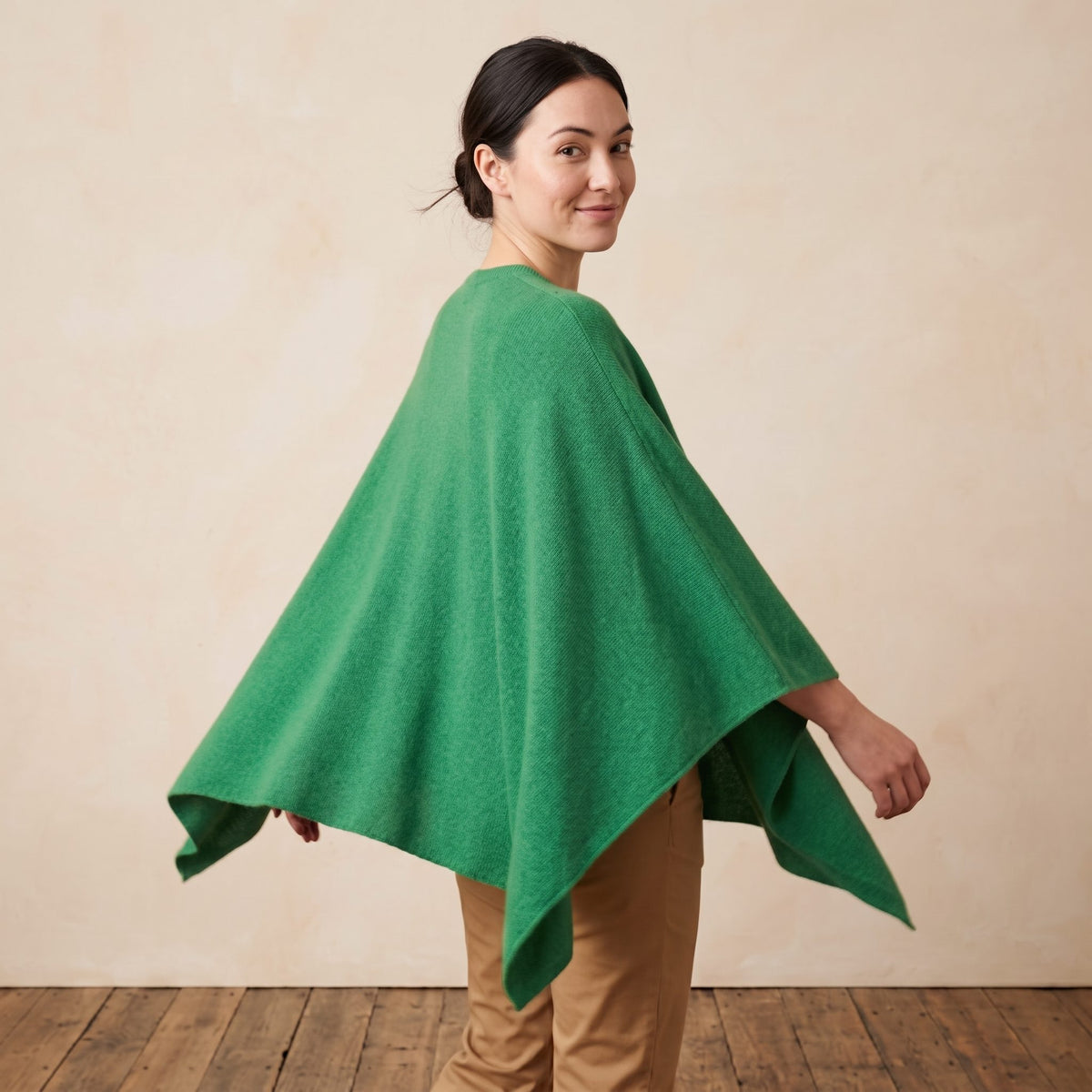 Women's V-neck cashmere poncho in Kelly Green — worn by a model (3)