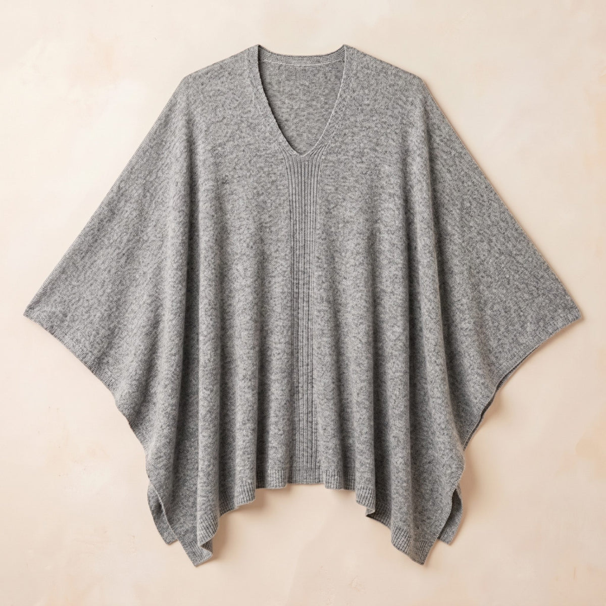 Women's undyed cashmere poncho in Light Grey Melange — laid flat