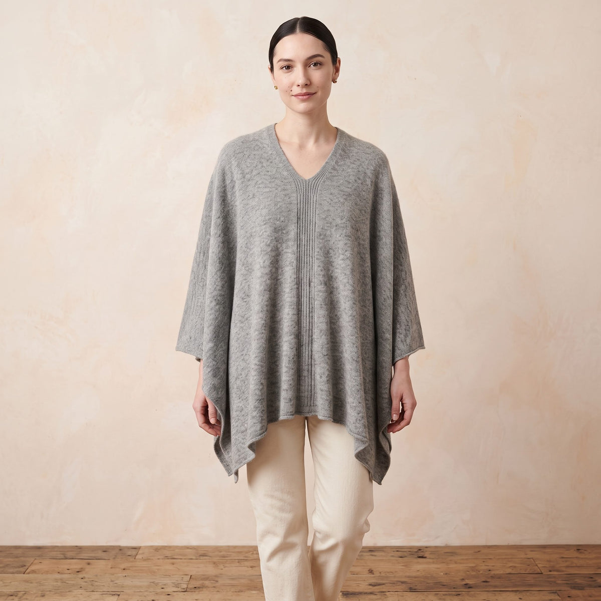 Women's undyed cashmere poncho in Light Grey Melange — worn by a model (3)