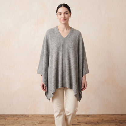 Women's undyed cashmere poncho in Light Grey Melange — worn by a model (3)