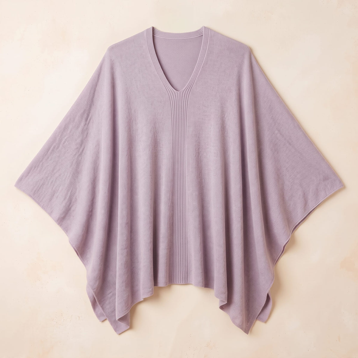 Women's V-neck cashmere poncho in Lilac — laid flat