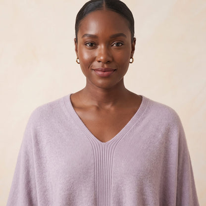Women's V-neck cashmere poncho in Lilac — worn by a model