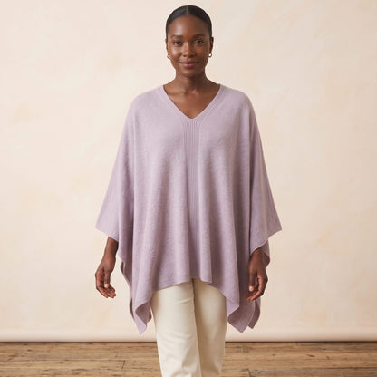 Women's V-neck cashmere poncho in Lilac — worn by a model (2)