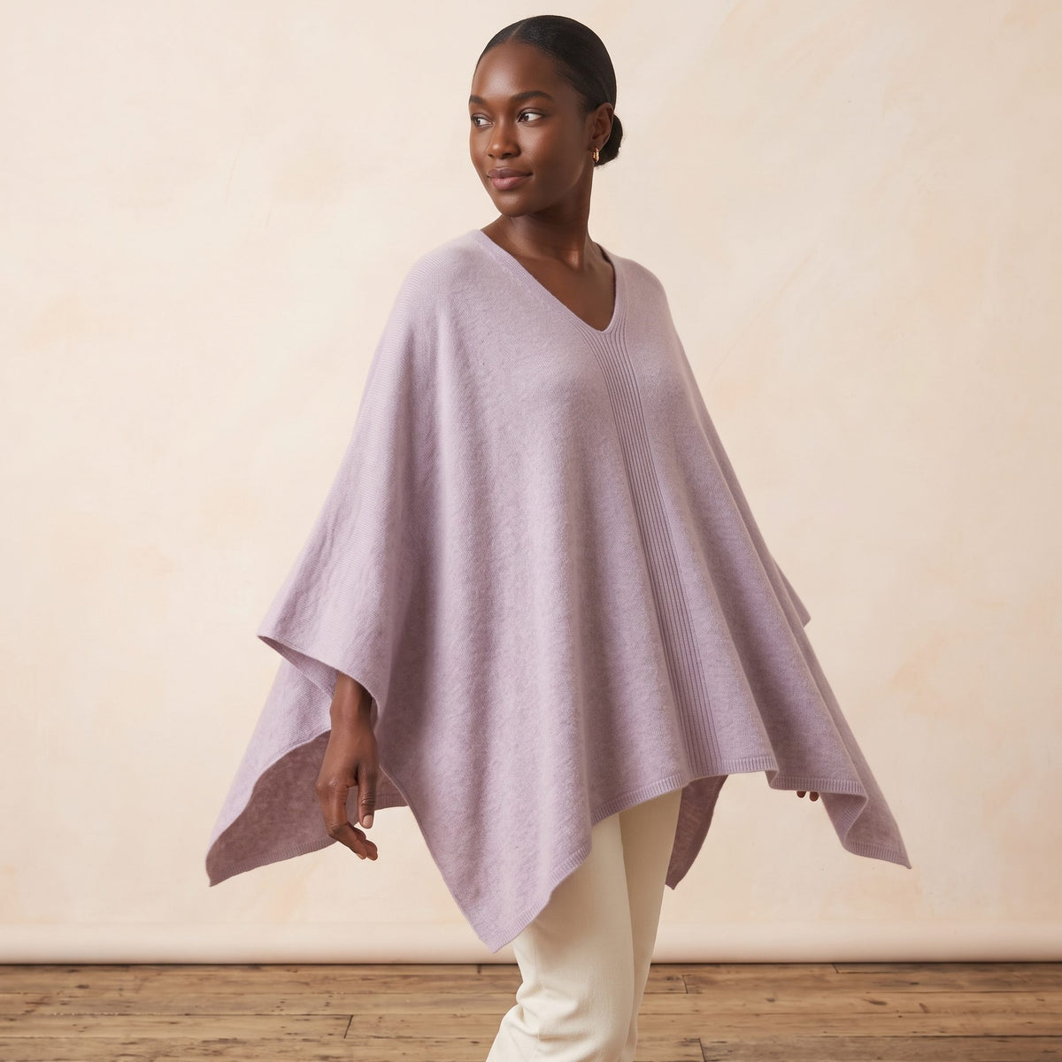 Women's V-neck cashmere poncho in Lilac — worn by a model (3)