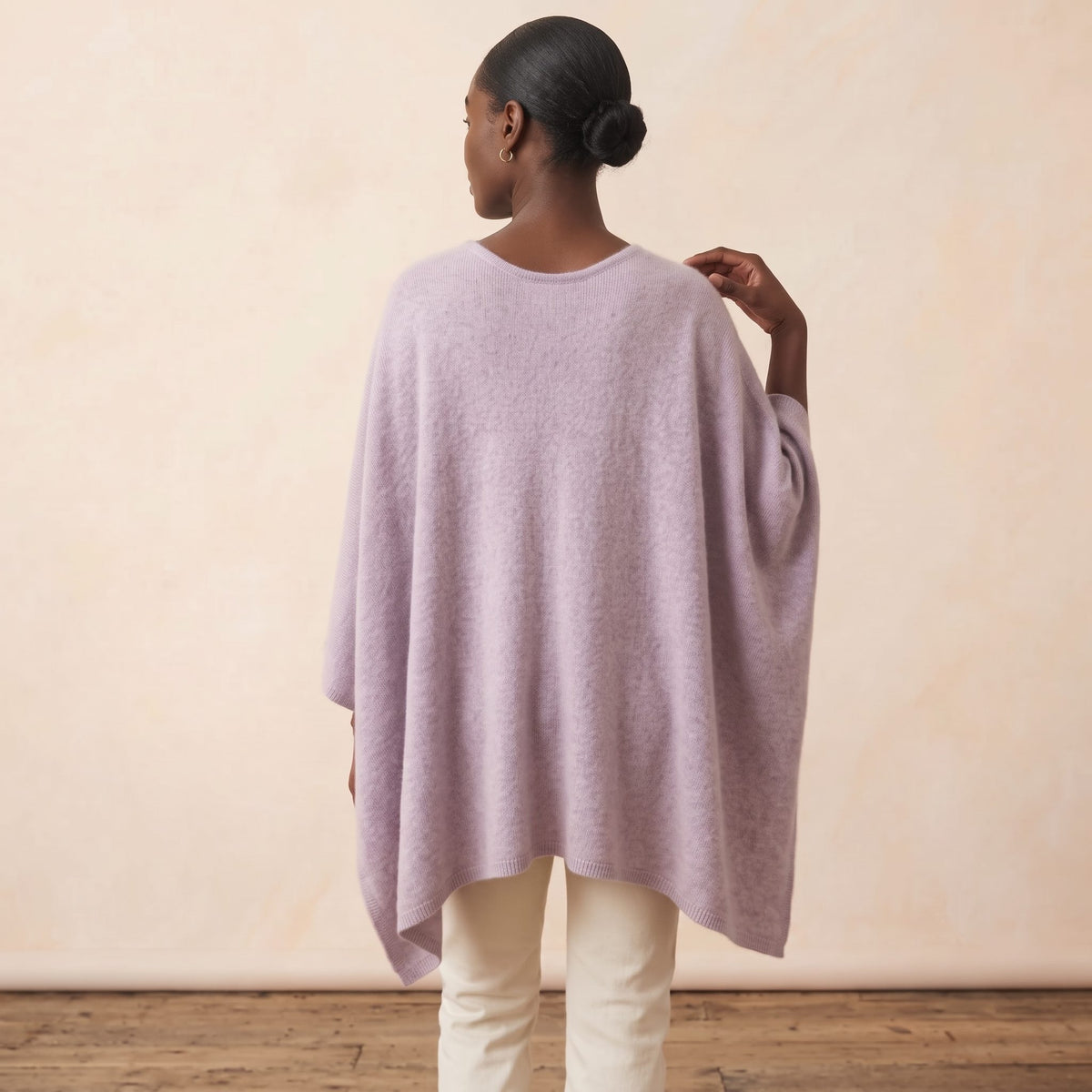 Women's V-neck cashmere poncho in Lilac — worn by a model (4)