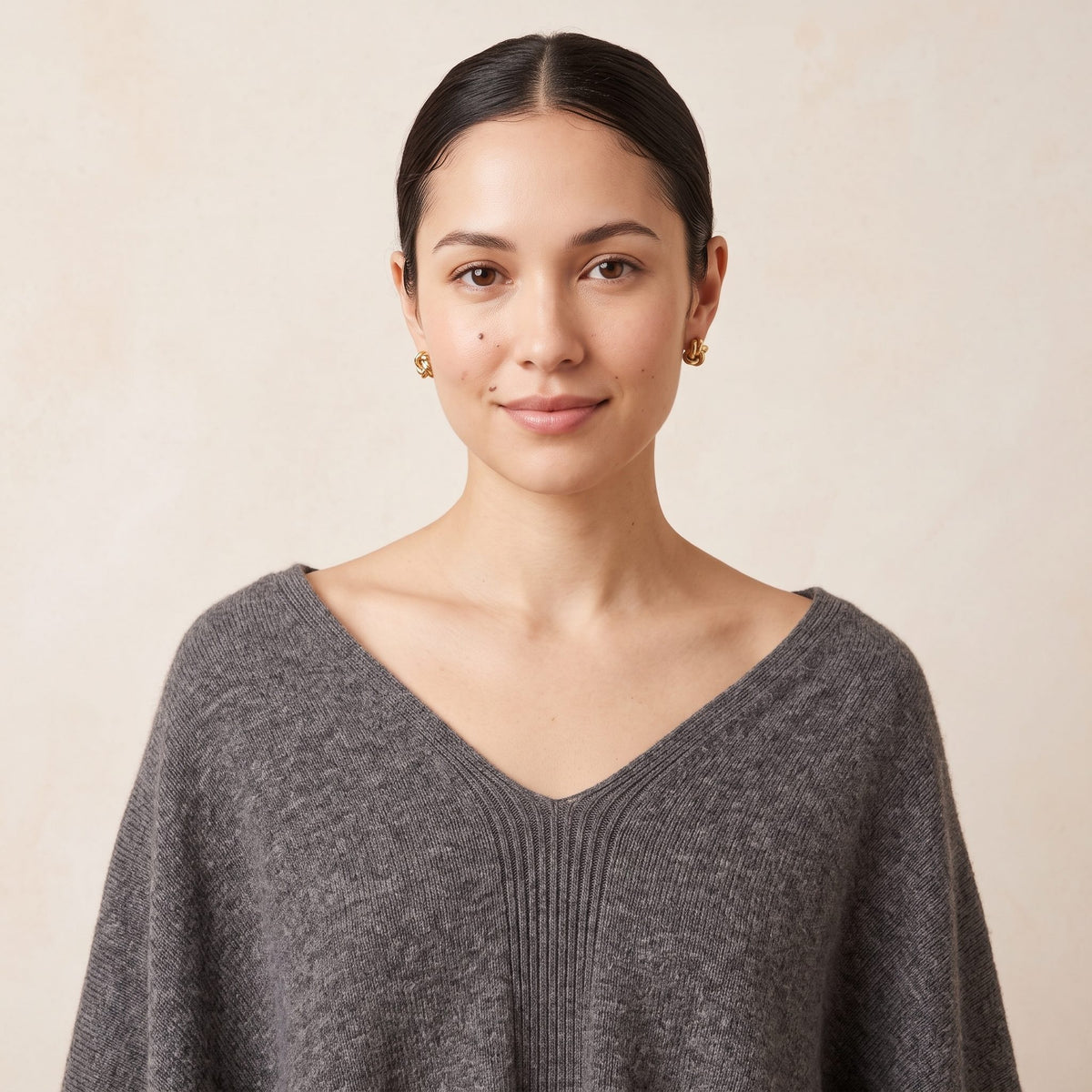 Women's undyed cashmere poncho in Mid Grey Melange — worn by a model